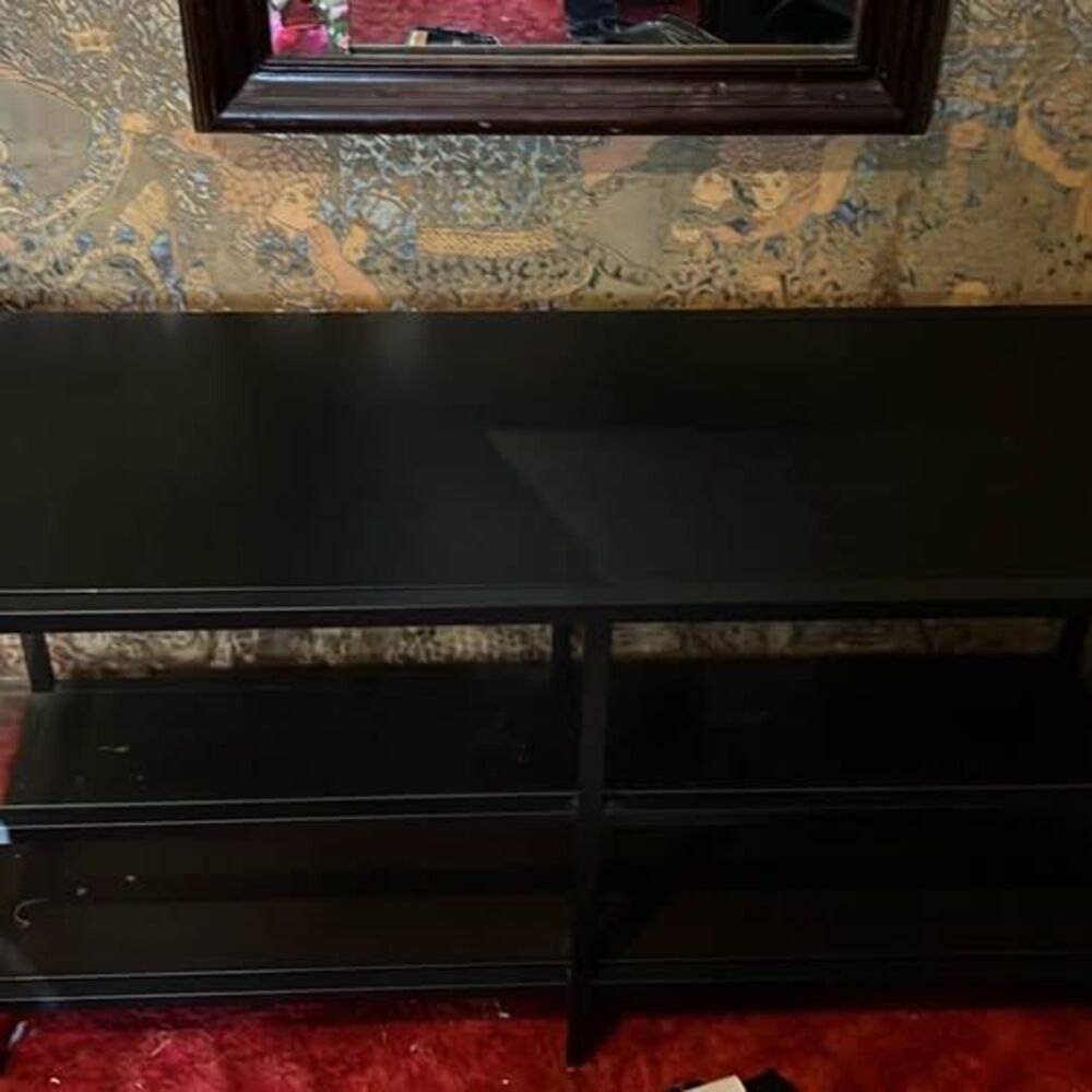 Black metal and glass three shelf entertainment stand.